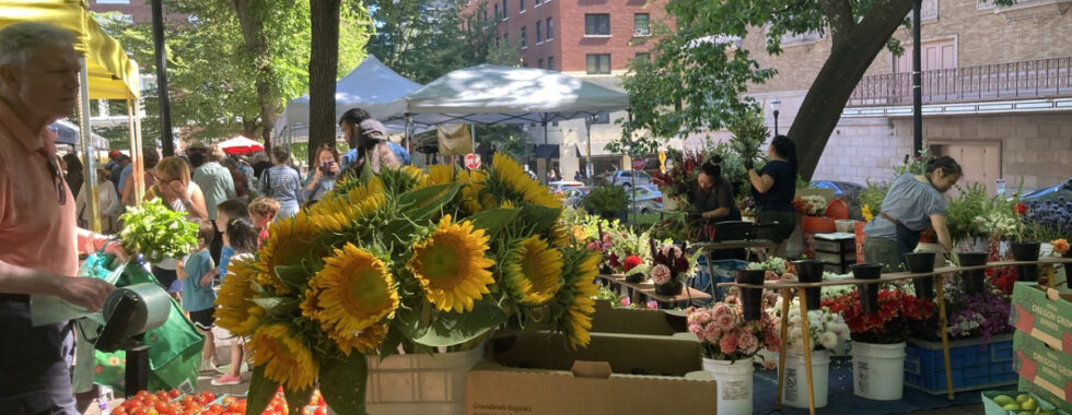 photo of farmers market with sunflowers